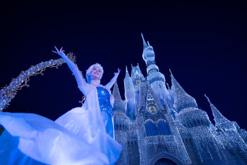 Queen Elsa from “Frozen” Transforms Cinderella Castle in 